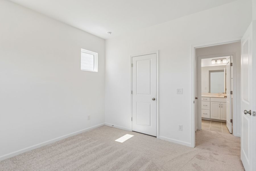 Spacious, unfurnished interior of a new home in Terraces at the Exchange, Indian Land (Image 30).