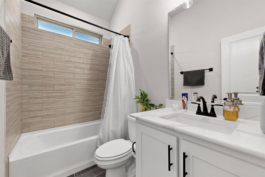 Bathroom with shower / bath combo and vanity Bathroom with shower / bath combo and vanity