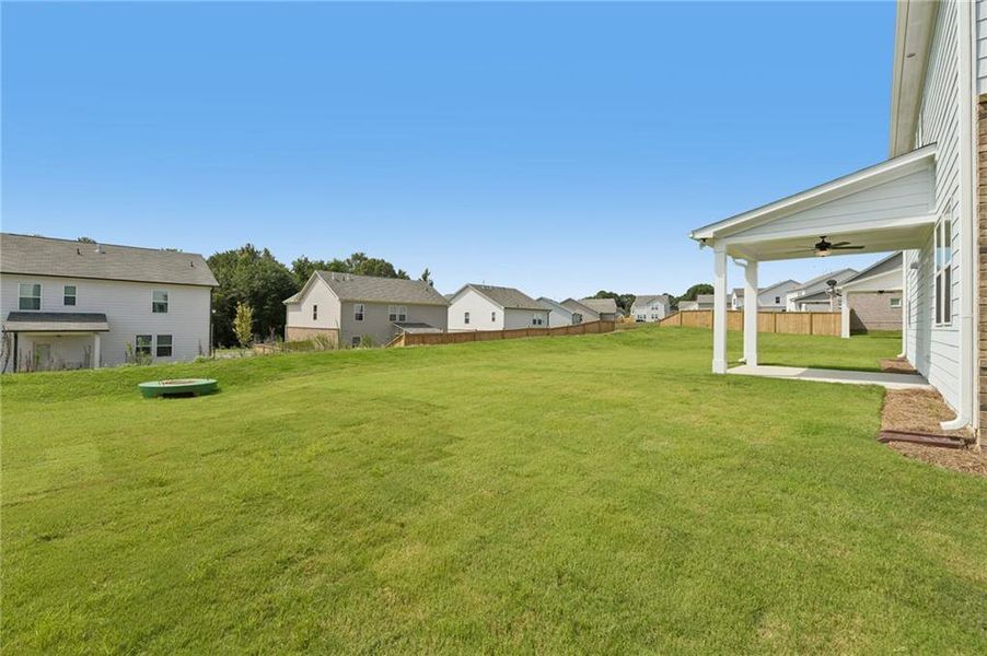 Exterior details and patio area of a home in Windance Lake, Loganville (Image 24).