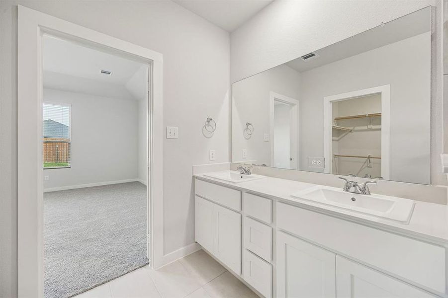 Primary Bathroom in the Stanley II home plan by Trophy Signature Homes – REPRESENTATIVE PHOTO