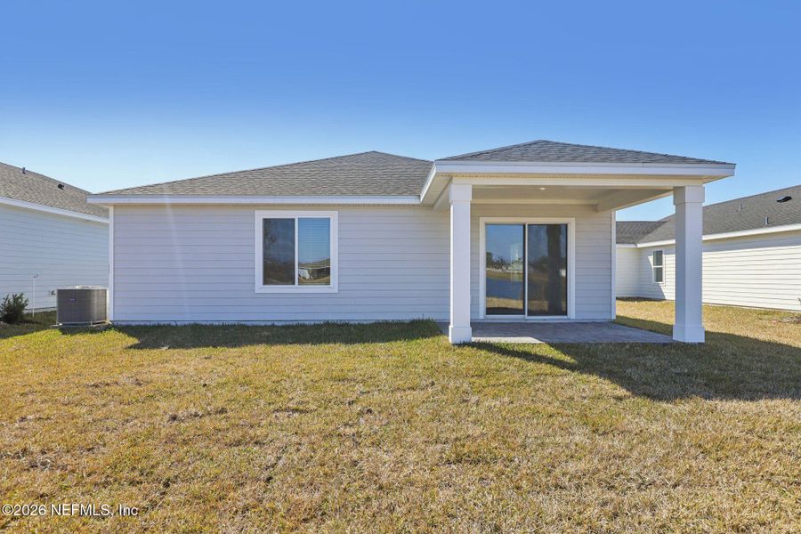 Exterior details and patio area of a home in Colbert Landings, Palm Coast (Image 4).