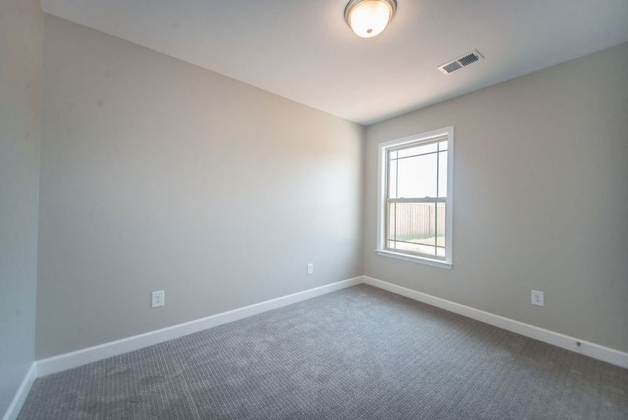 Representative unfurnished interior of a home built from the Pacific by Enchanted Homes in Hampshire Heights, Moore (Image 32).