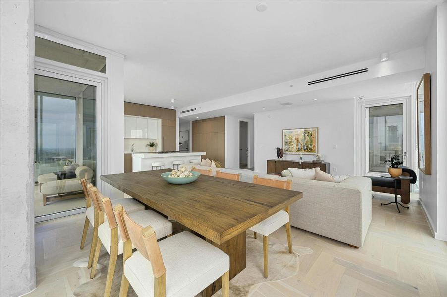 The dining area is strategically positioned near the kitchen and living area, creating a seamless flow for dining and entertaining. The dining area is strategically positioned near the kitchen and living area, creating a seamless flow for dining and entertaining.