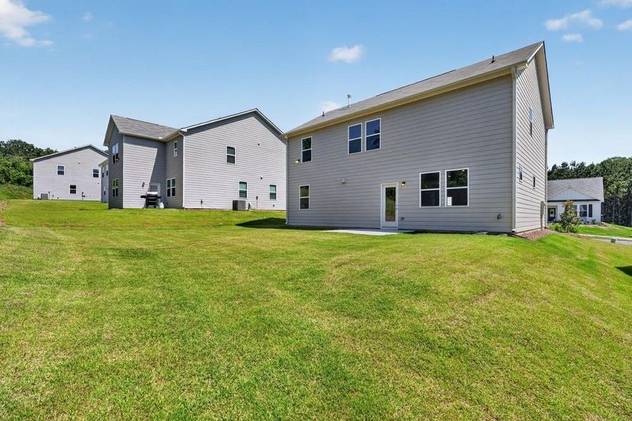 Exterior details and patio area of a home in Heritage River, Euharlee (Image 4).