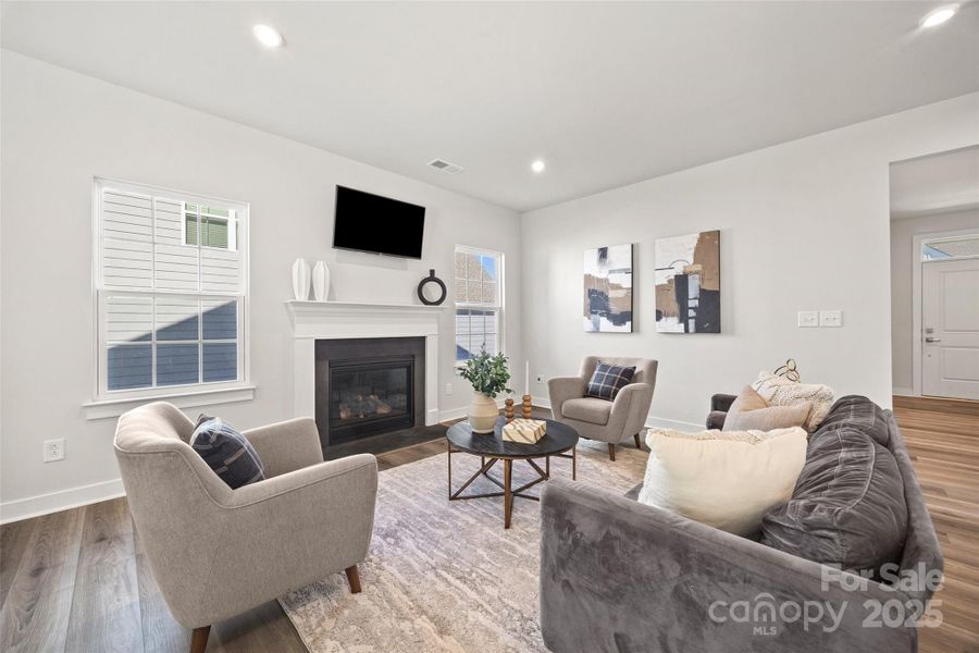 Bright living room with cozy fireplace Bright living room with cozy fireplace