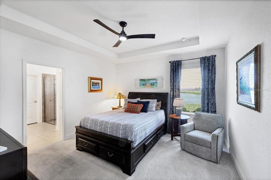 Primary Bedroom With Serene Lake Views Primary Bedroom With Serene Lake Views