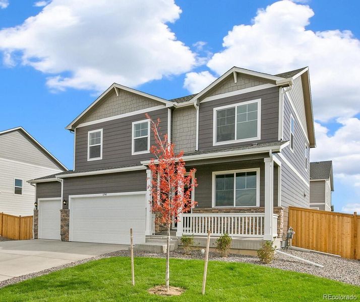 Front exterior of a new home in Lakeside Canyon, Mead, CO, highlighting curb appeal (Image 2).