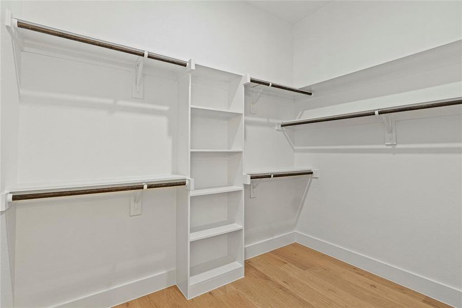 Spacious closet with light wood-type flooring