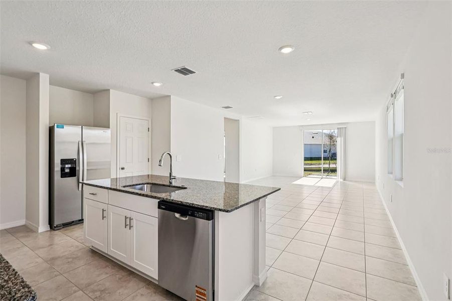 Furnished interior view inside a new home in Lake Deer Estates - Classic Series, Poinciana (Image 6).