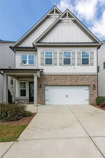 Front exterior of a new home in , Cumming, GA, highlighting curb appeal (Image 1). Front exterior of a new home in , Cumming, GA, highlighting curb appeal (Image 1).