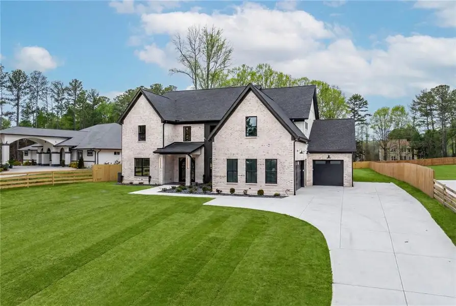 Front exterior of a new home in , Dacula, GA, highlighting curb appeal (Image 26).