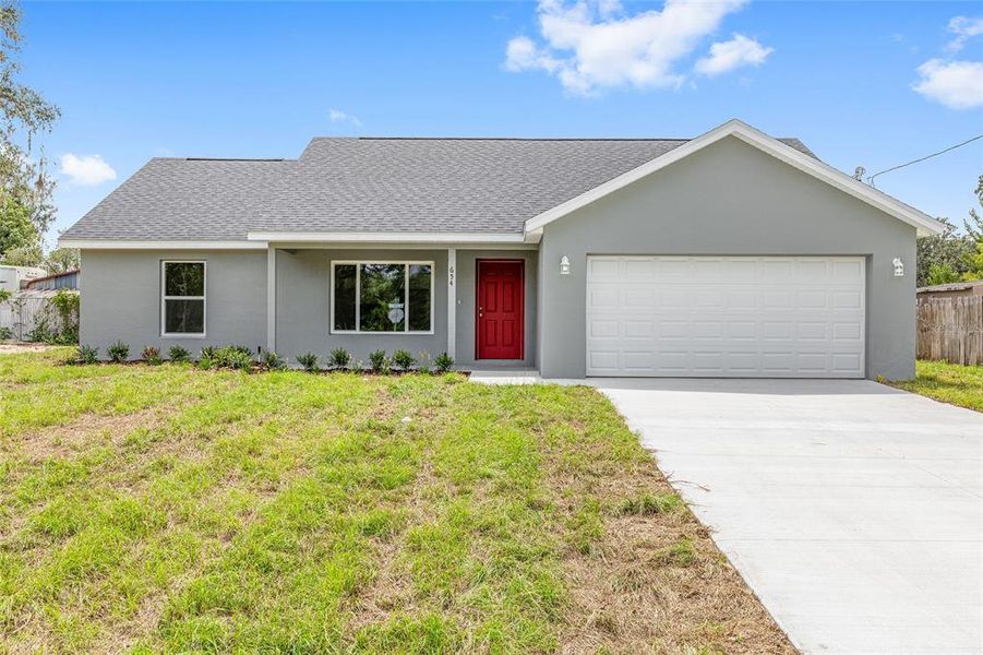 Front exterior of a new home in , Dunnellon, FL, highlighting curb appeal (Image 19).