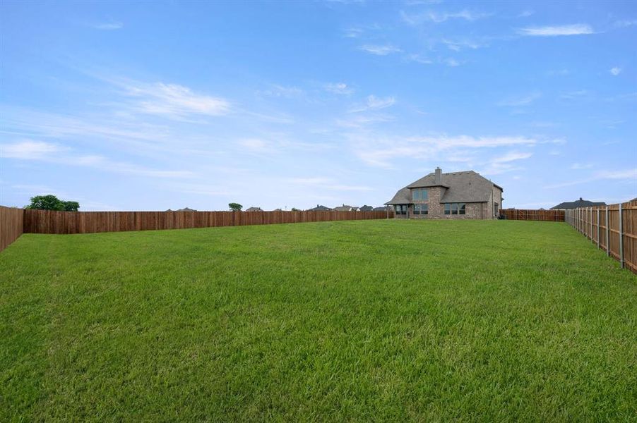 Exterior details and patio area of a home in Coyote Crossing, Godley (Image 23).