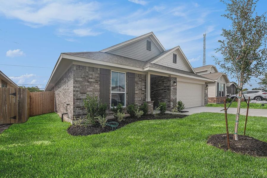 Front exterior of a new home in Kiber Reserve, Angleton, TX, highlighting curb appeal (Image 1). Front exterior of a new home in Kiber Reserve, Angleton, TX, highlighting curb appeal (Image 1).