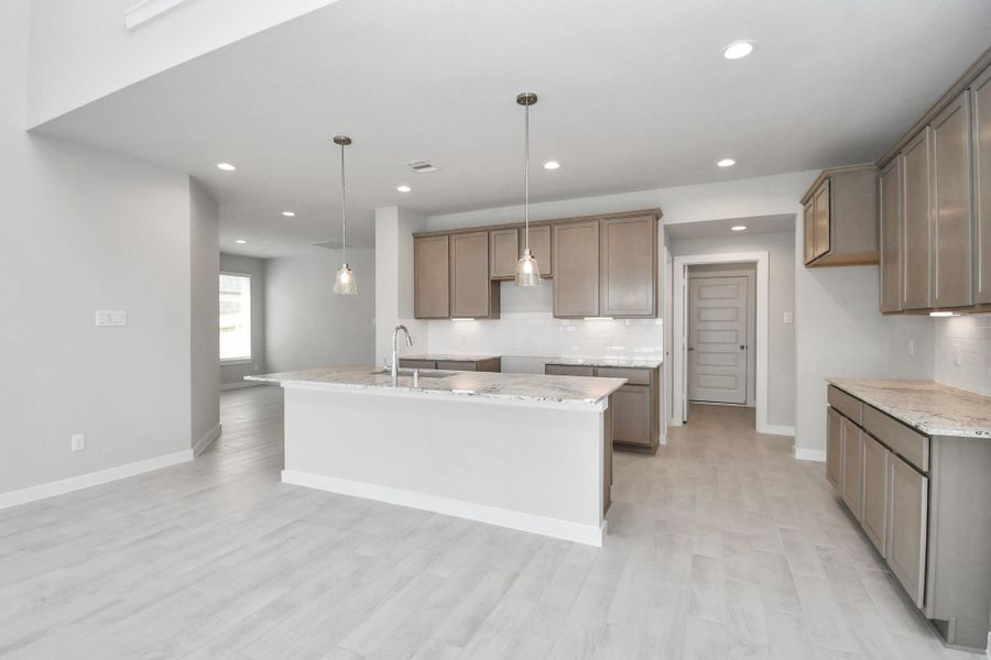 This kitchen is truly a chef's dream! Sample photo of completed home with similar floor plan. Actual colors and selections may vary. This kitchen is truly a chef's dream! Sample photo of completed home with similar floor plan. Actual colors and selections may vary.