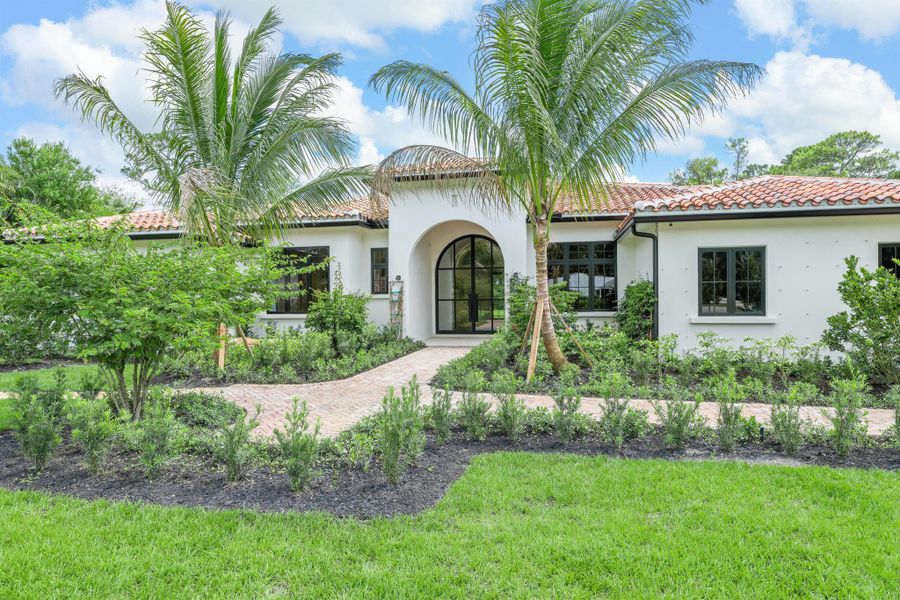 Front exterior of a new home in , Wellington, FL, highlighting curb appeal (Image 1).