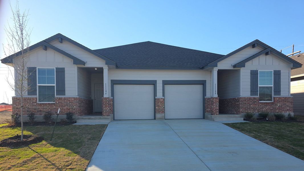 Front exterior of a new home in The Terrace Duplexes, Temple, TX, highlighting curb appeal (Image 1). Front exterior of a new home in The Terrace Duplexes, Temple, TX, highlighting curb appeal (Image 1).