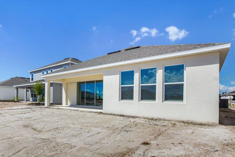 Exterior details and patio area of a home in Firethorn, Parrish (Image 28).
