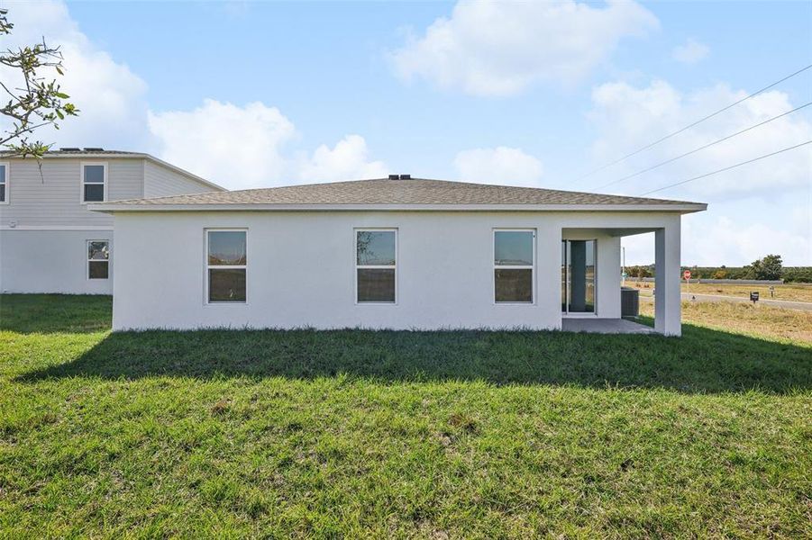 Exterior details and patio area of a home in The Enclave at Scenic Terrace, Haines City (Image 8).
