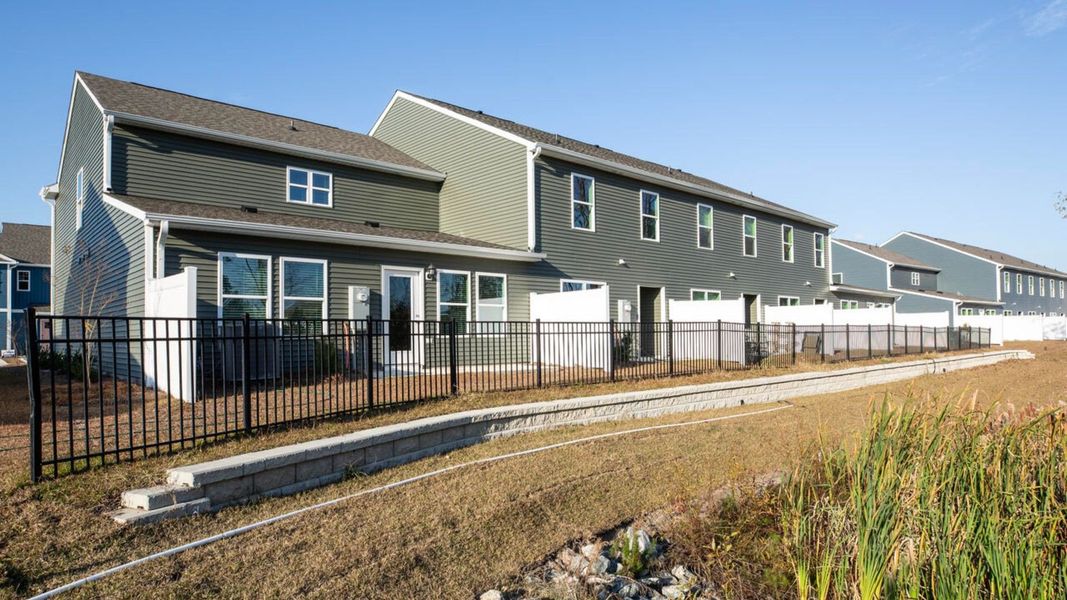 Exterior details and patio area of a home in Waterside Townhomes, Surf City (Image 3).