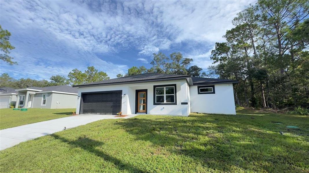 Front exterior of a new home in , Citrus Springs, FL, highlighting curb appeal (Image 18). Front exterior of a new home in , Citrus Springs, FL, highlighting curb appeal (Image 18).
