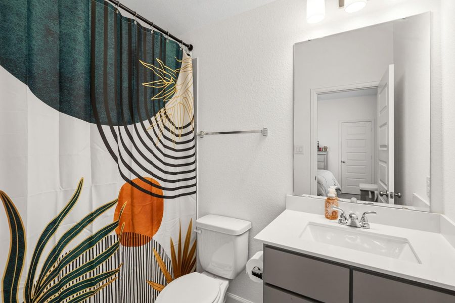 Well-appointed full bathroom with modern fixtures and stylish finishes