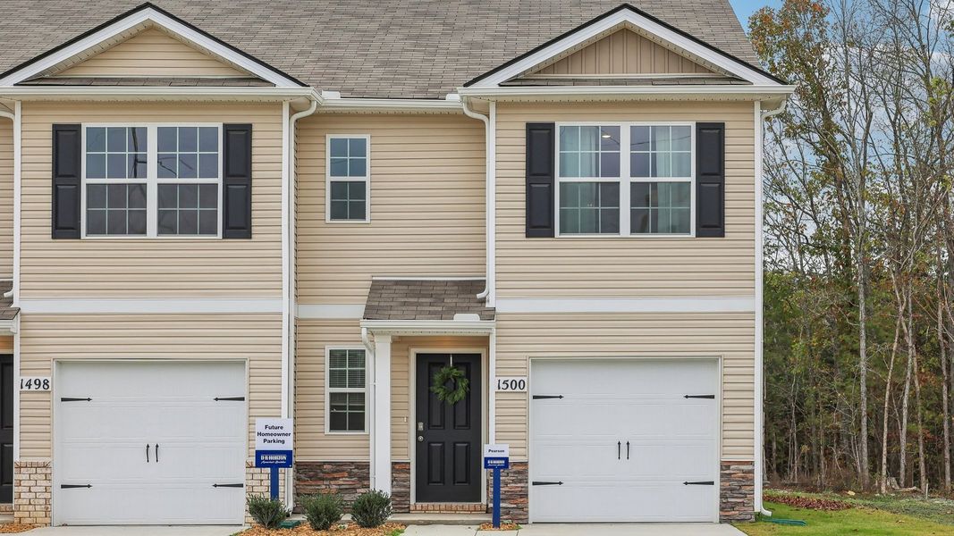 Front exterior of a new home in Saddle Trace Townhomes, Lewisburg, TN, highlighting curb appeal (Image 1).