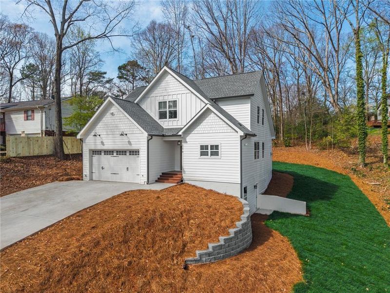Front exterior of a new home in , Woodstock, GA, highlighting curb appeal (Image 19).