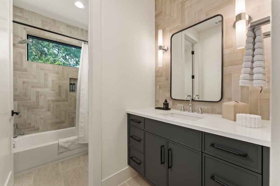 Full bathroom on the second floor with a garden tub.