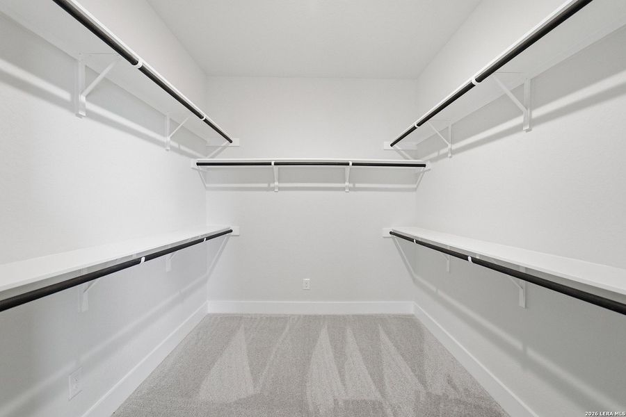 Spacious, unfurnished interior of a new home in The Woodlands at Medina Hills, Mico (Image 31).