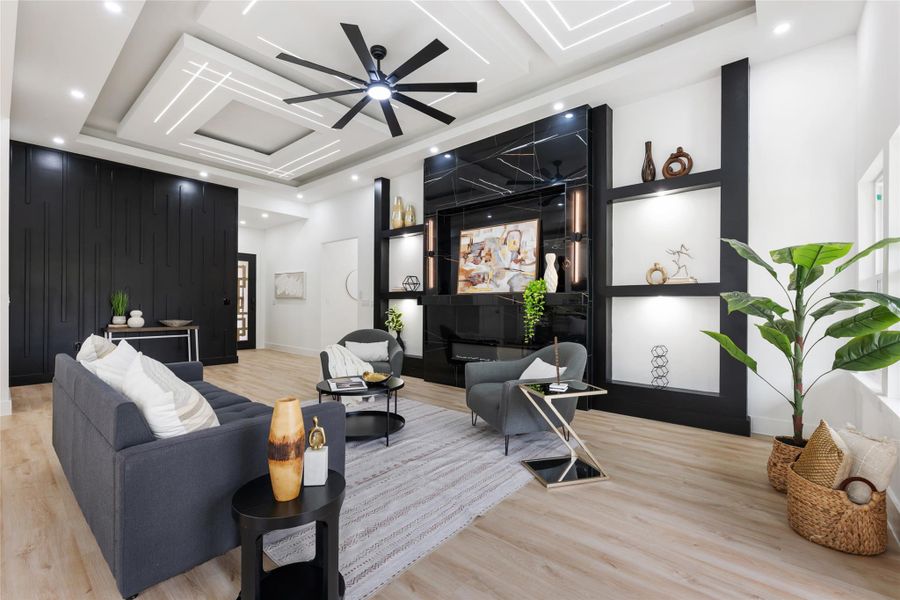 Spacious living area featuring a coffered ceiling with integrated lighting, a black accent wall, and light wood-finish flooring