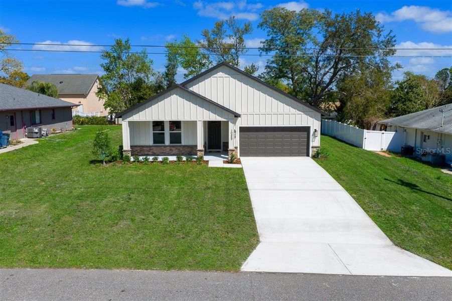 Front exterior of a new home in , Spring Hill, FL, highlighting curb appeal (Image 27). Front exterior of a new home in , Spring Hill, FL, highlighting curb appeal (Image 27).