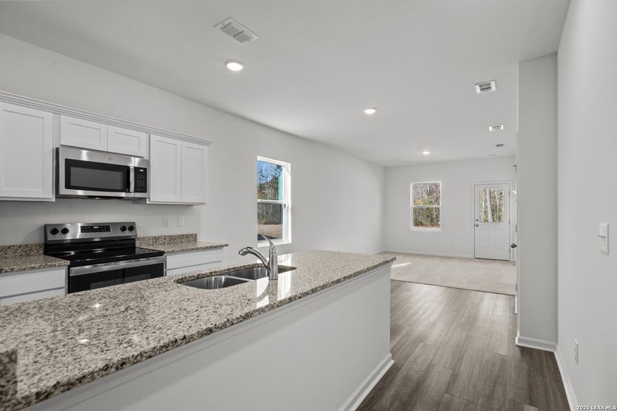 Furnished interior view inside a new home in Sutton Farms, San Antonio (Image 16).