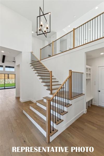 Step into our beautiful Montgomery IV dream home and be greeted by a gorgeous stair case featuring open metal railings and sight lines through to the rear of the home.  REPRESENTATIVE PHOTO