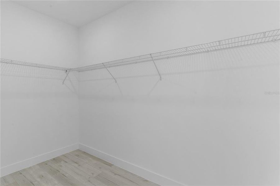 Walk-in closet in primary bedroom