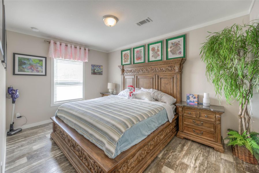 Secondary bedroom with walk-in closet.