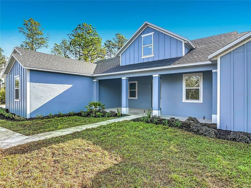 Front exterior of a new home in , Eustis, FL, highlighting curb appeal (Image 26).