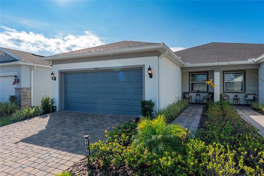 Front exterior of a new home in , Kissimmee, FL, highlighting curb appeal (Image 23).