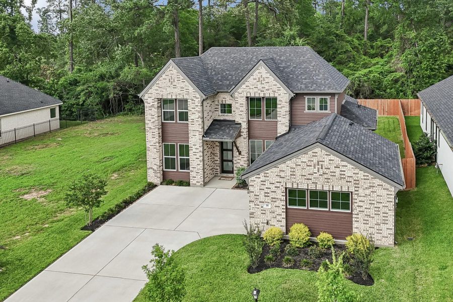 Front exterior of a new home in , Montgomery, TX, highlighting curb appeal (Image 28). Front exterior of a new home in , Montgomery, TX, highlighting curb appeal (Image 28).