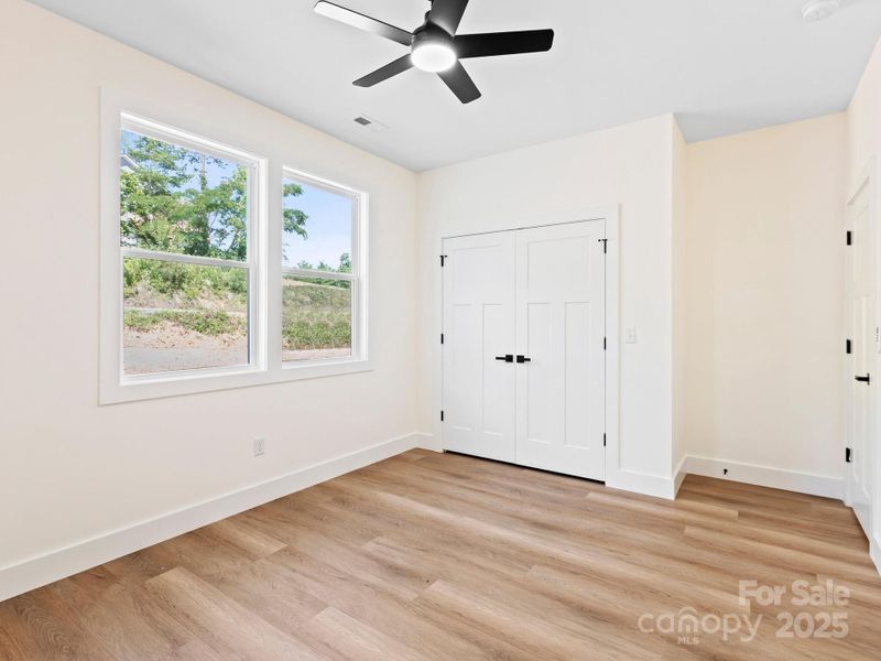 Large double door closet has shelving already in place