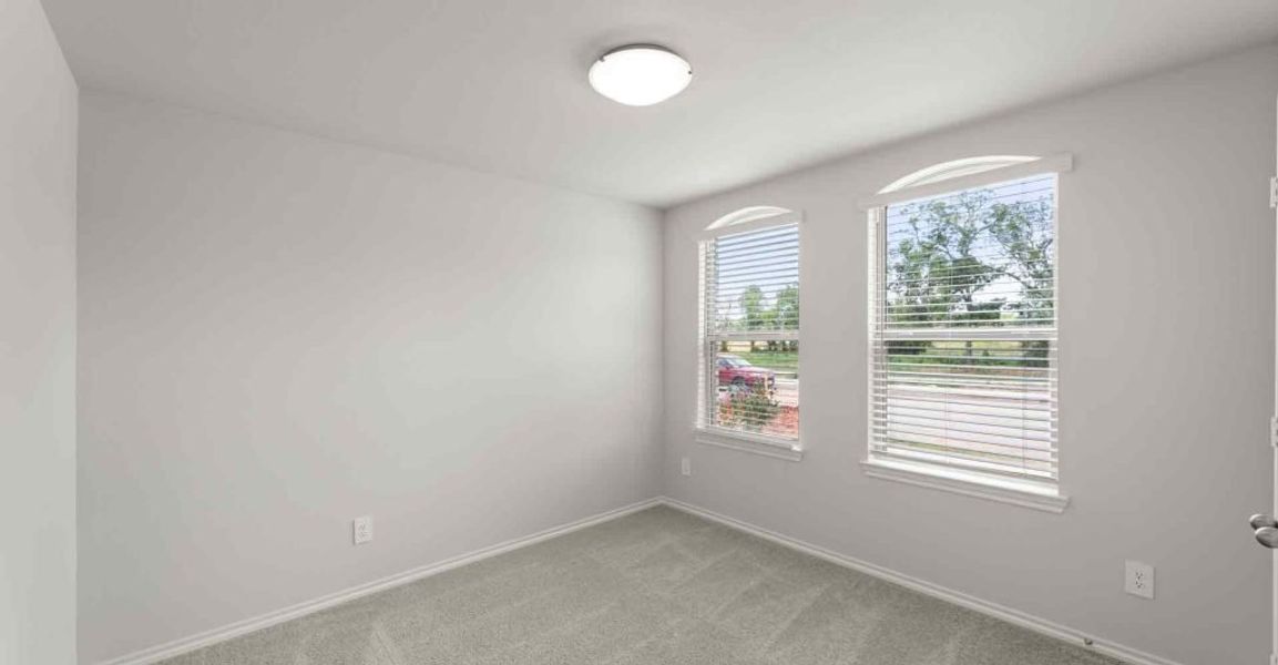 Representative exterior photo of a completed home built from the Atlanta by Impression Homes in Keeneland, Aubrey, TX (Image 20).