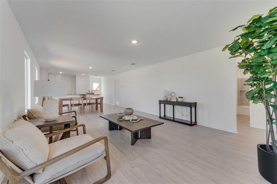 Living room with light hardwood / wood-style floors