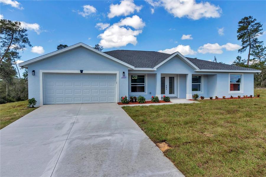 Front exterior of a new home in , Ocala, FL, highlighting curb appeal (Image 27).