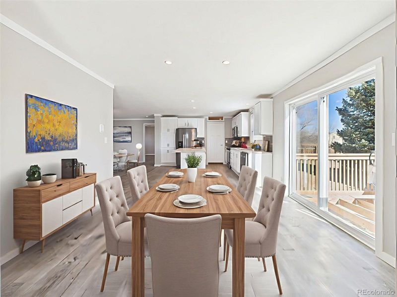 Virtually Staged Dining Area – This staged dining space off the kitchen offers a sunny setting next to sliding glass doors, perfect for indoor-outdoor meals and gatherings.