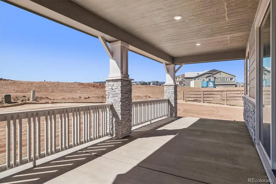Exterior details and patio area of a home in Peakview at Ascent Village, Littleton (Image 3).