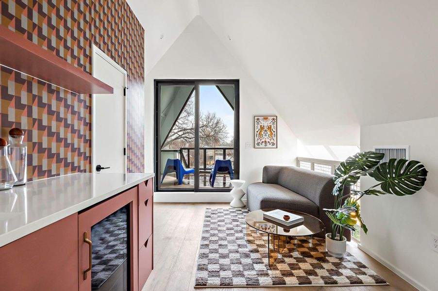 Sitting room with built in wet bar, panel ready beverage fridge, and covered deck with downtown views Sitting room with built in wet bar, panel ready beverage fridge, and covered deck with downtown views