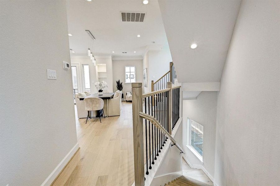 Beautiful Contemporary wood staircase with wood and metal stair handrails.