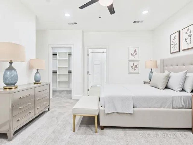 Bedroom featuring a spacious closet, light colored carpet, ceiling fan, and recessed lighting Bedroom featuring a spacious closet, light colored carpet, ceiling fan, and recessed lighting