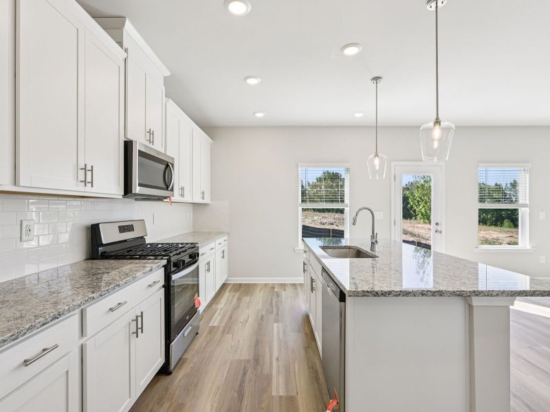 Furnished interior view inside a new home in Moss Farms, Lula (Image 7).