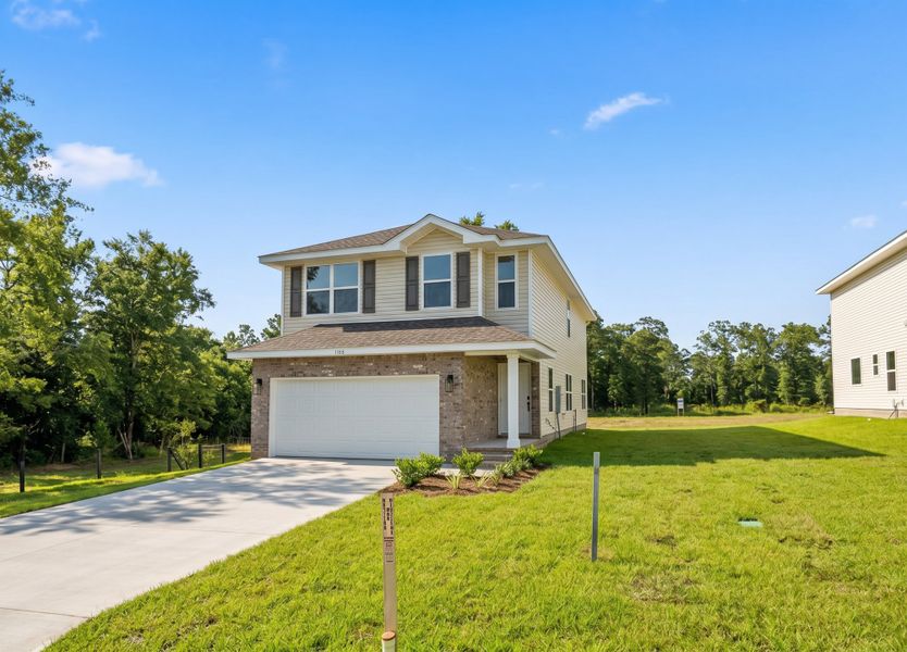 Front exterior of a new home in Pine Top, Cantonment, FL, highlighting curb appeal (Image 2). Front exterior of a new home in Pine Top, Cantonment, FL, highlighting curb appeal (Image 2).